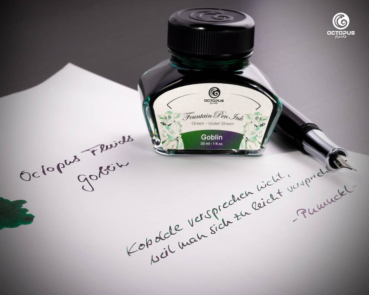 Handwritten passage and ink swatch beside an Octopus Fluids Goblin 30 mL ink bottle and fountain pen