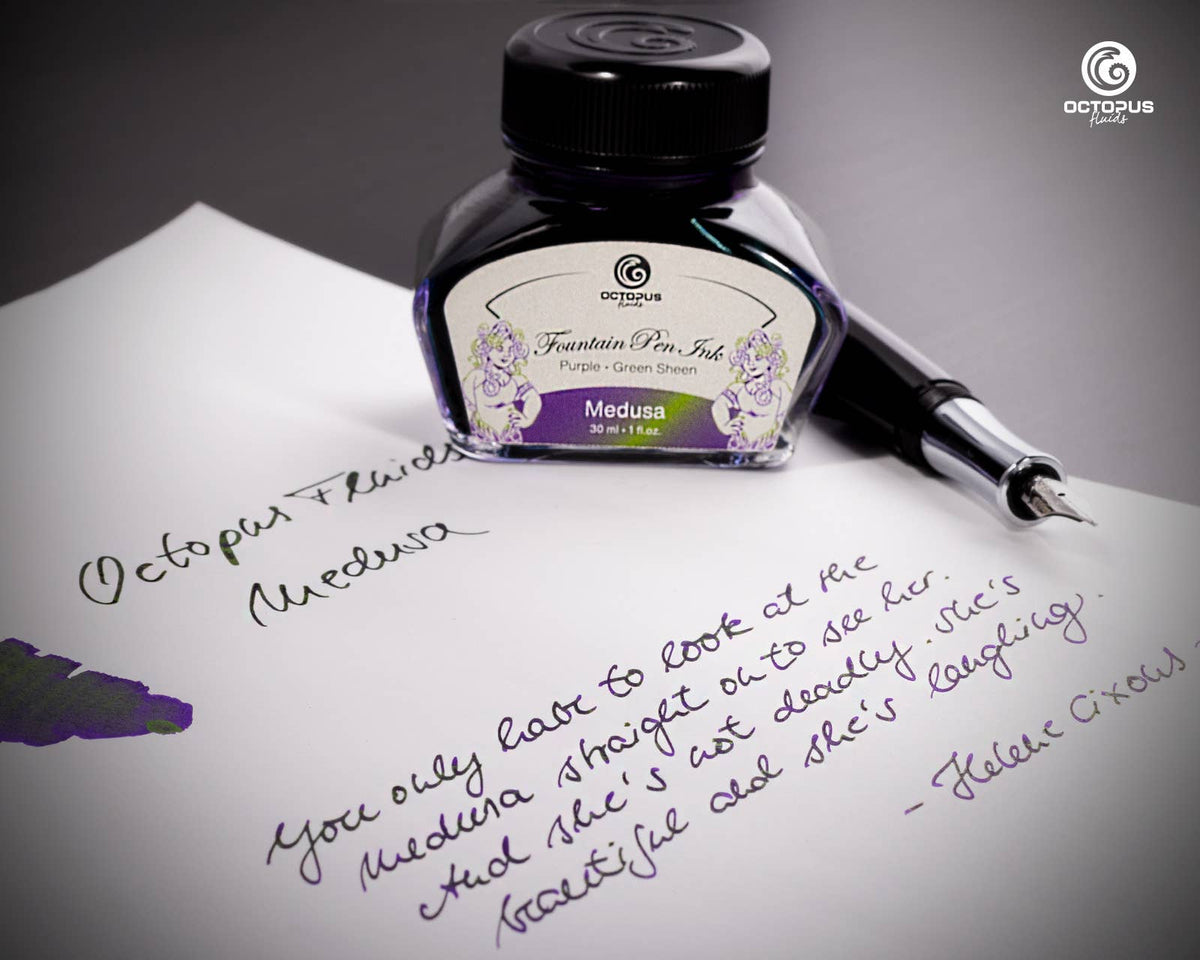 Handwritten passage and ink swatch beside an Octopus Fluids Medusa 30 mL ink bottle and fountain pen