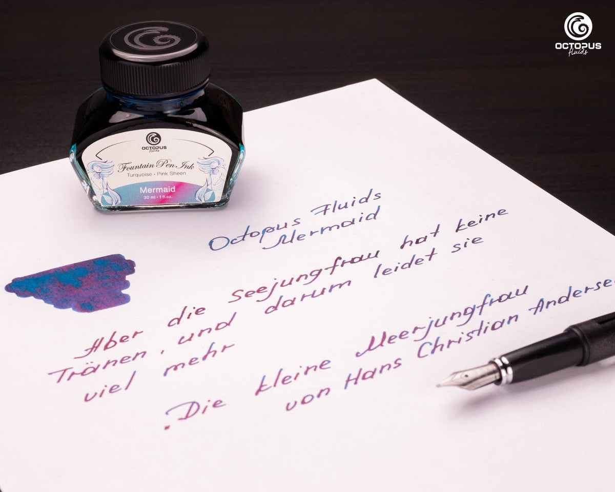 Handwritten passage and ink swatch beside an Octopus Fluids Mermaid 30 mL ink bottle and fountain pen