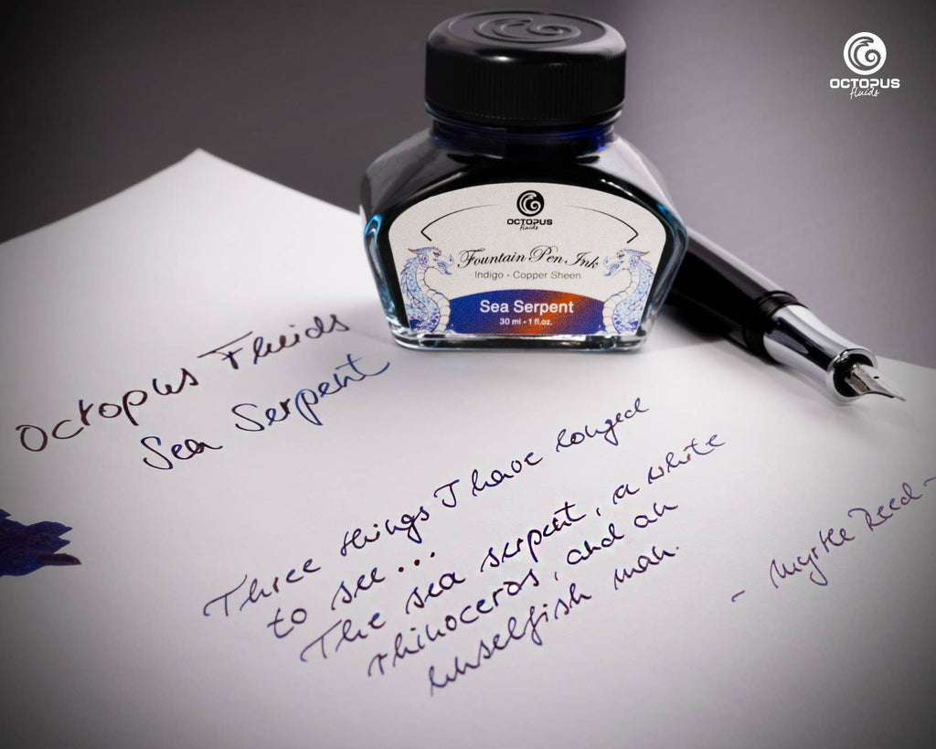 Handwritten passage and ink swatch beside an Octopus Fluids Sea Serpent 30 mL ink bottle and fountain pen