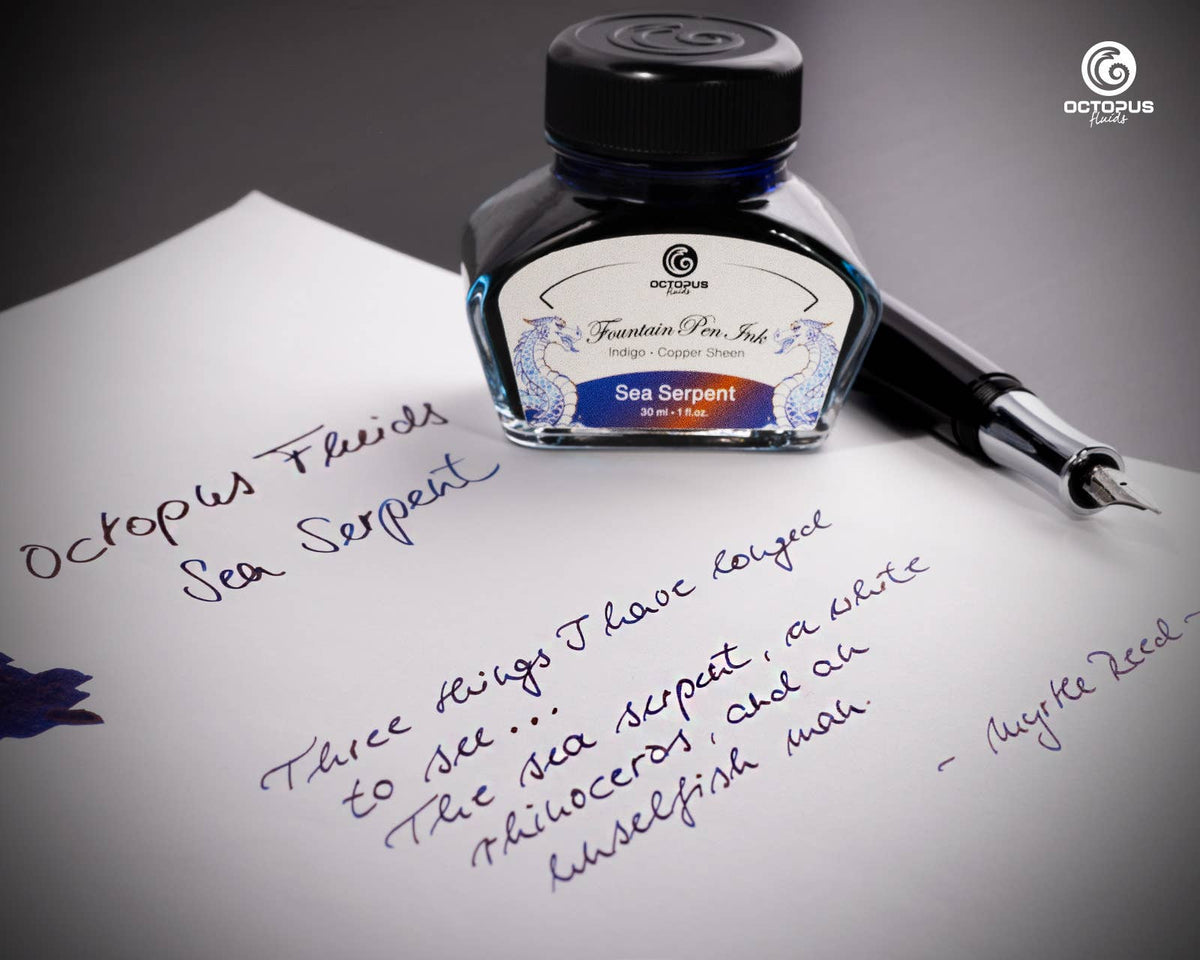 Handwritten passage and ink swatch beside an Octopus Fluids Sea Serpent 30 mL ink bottle and fountain pen
