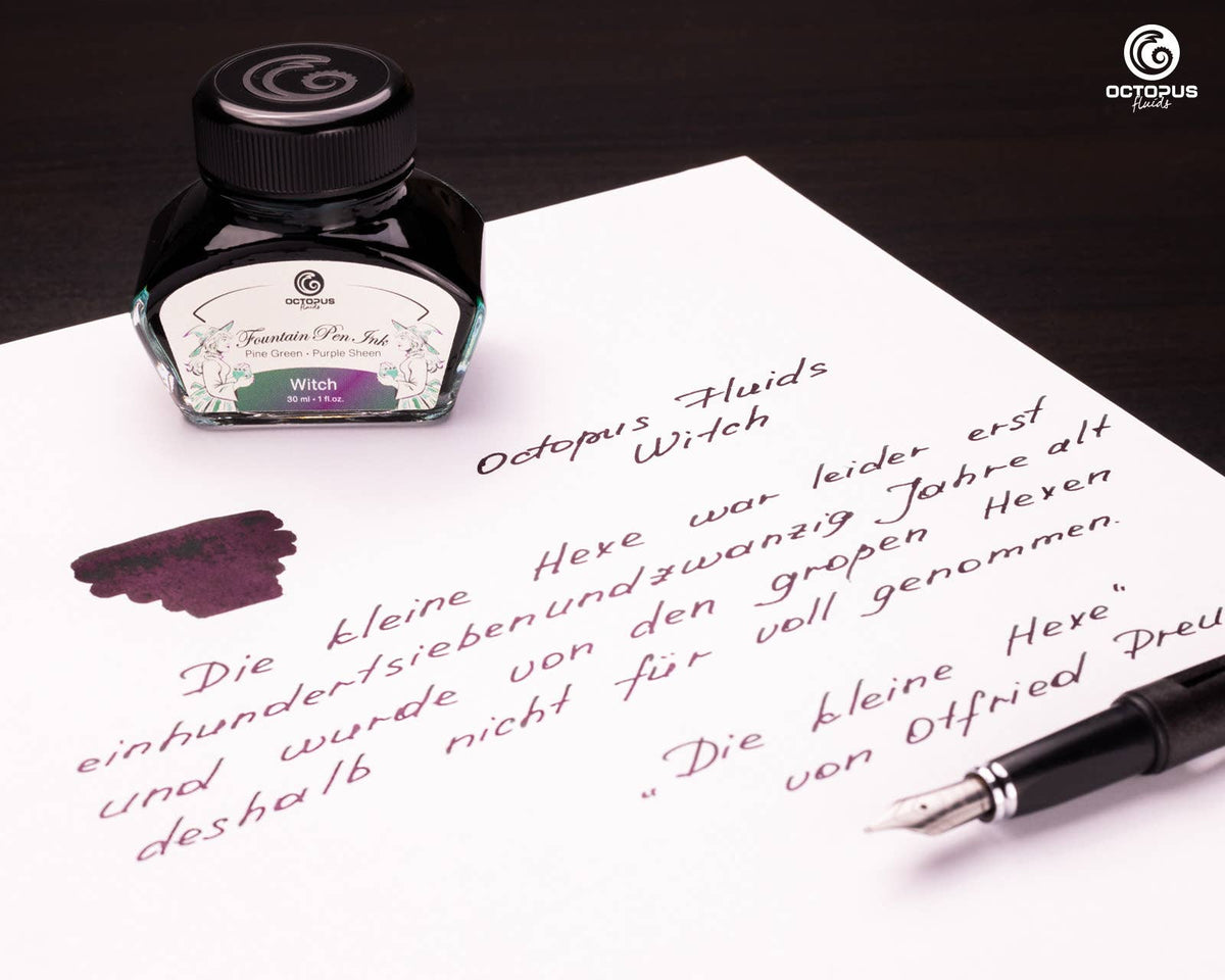 Handwritten passage and ink swatch beside an Octopus Fluids Witch 30 mL ink bottle and fountain pen