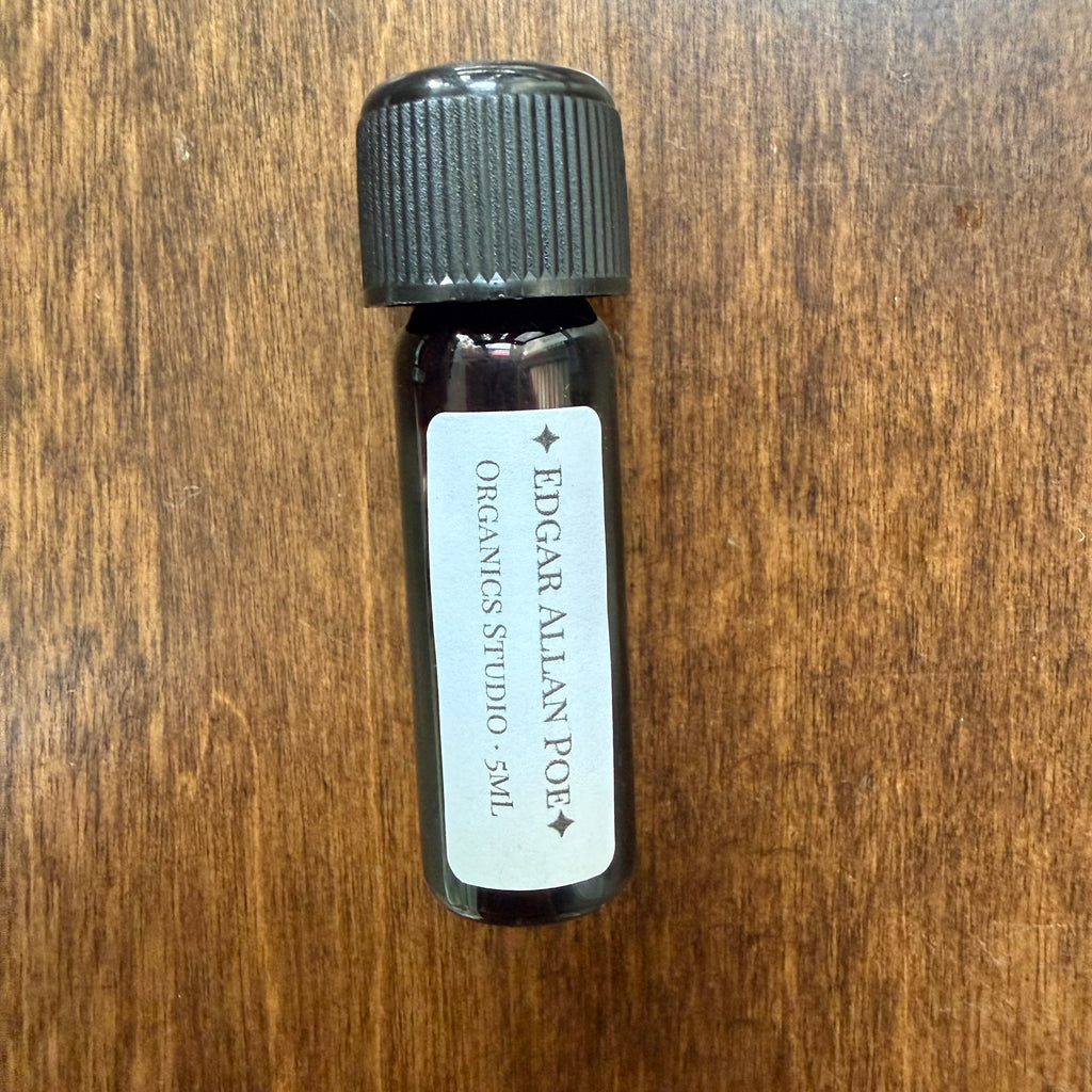 Front view of Organics Studio Edgar Allan Poe 5 mL Archive Bottle showing the ink label and black screw cap
