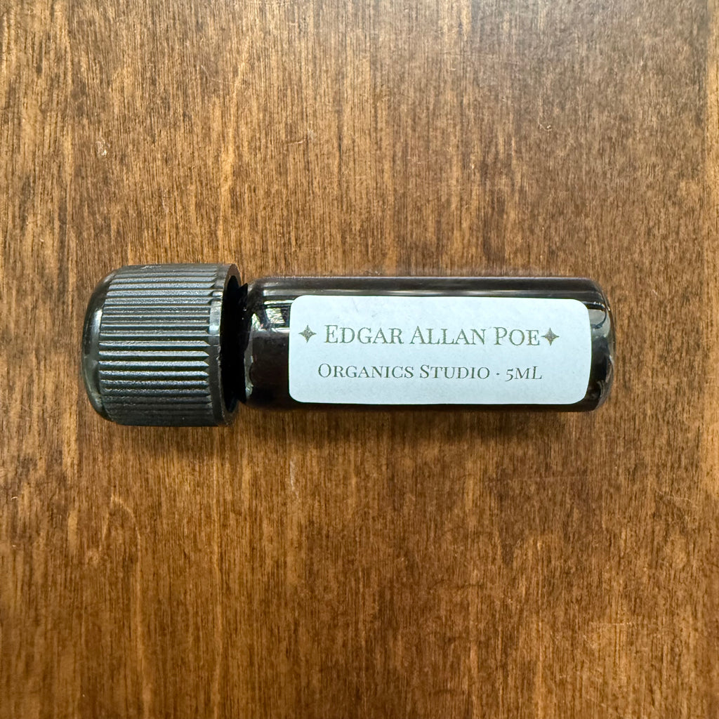 Organics Studio Edgar Allan Poe 5 mL Archive Bottle lying horizontally with its literary label visible