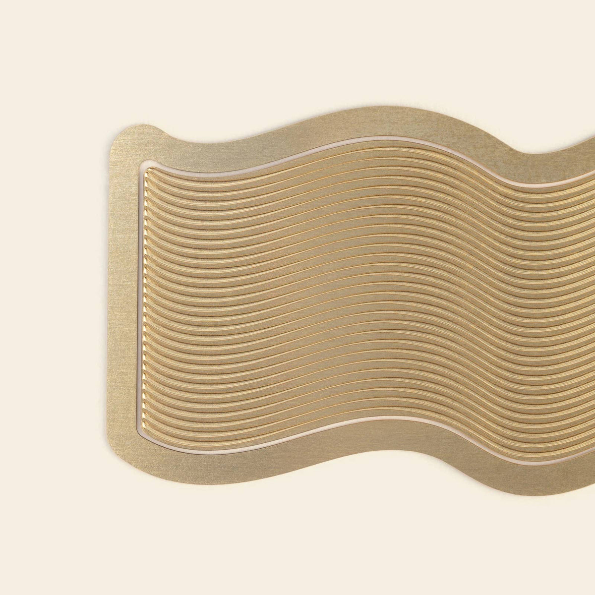 Papier Wave brass bookmark shown in a book