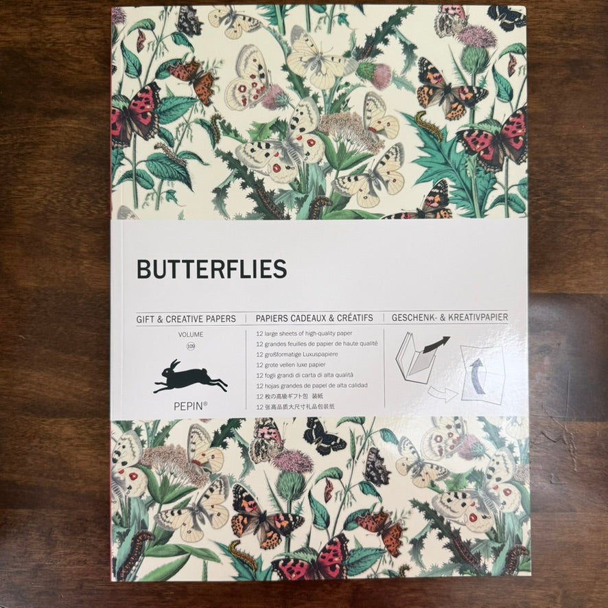 PEPIN Butterflies Gift & Creative Paper Book front cover on a dark wood surface