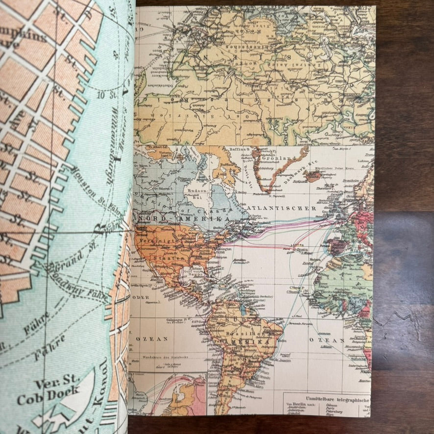 Open PEPIN Maps paper book showing antique city and world map designs