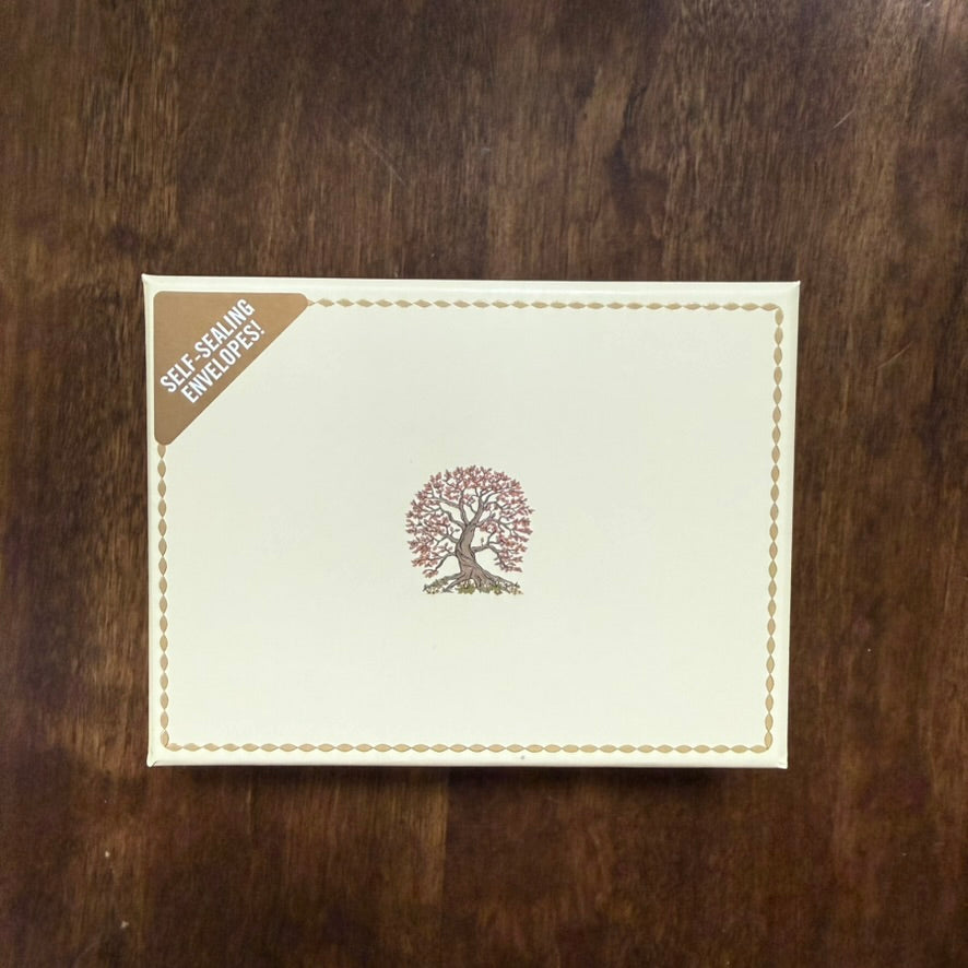 Detail view of the gold-foil Tree of Life design on the note cards