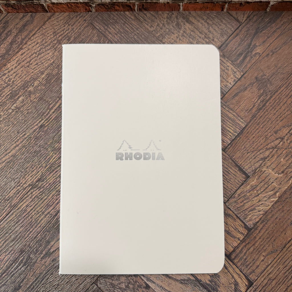 White Rhodia Ice A5 lined notebook with a silver Rhodia logo and rounded corners