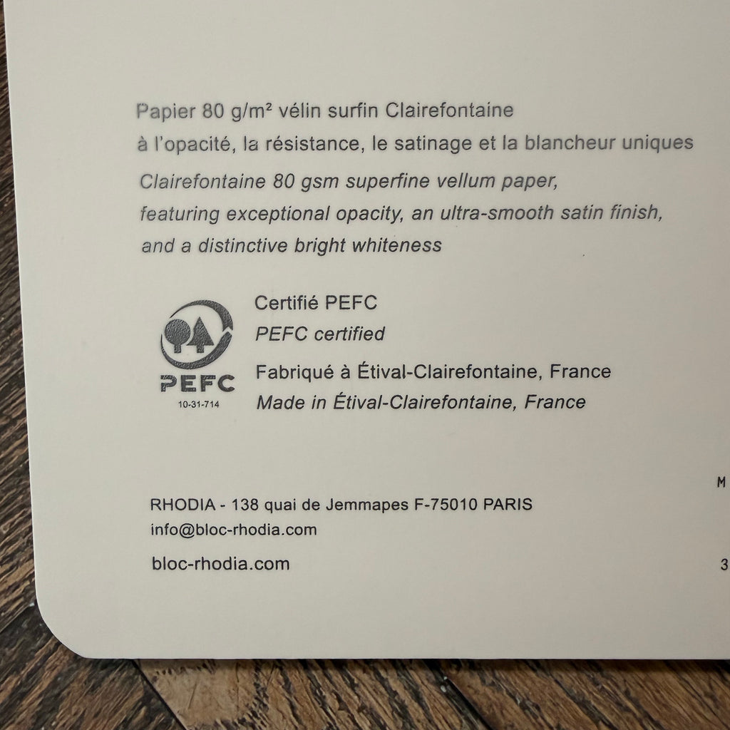 Rhodia notebook label describing 80 gsm Clairefontaine paper, PEFC certification, and French manufacture