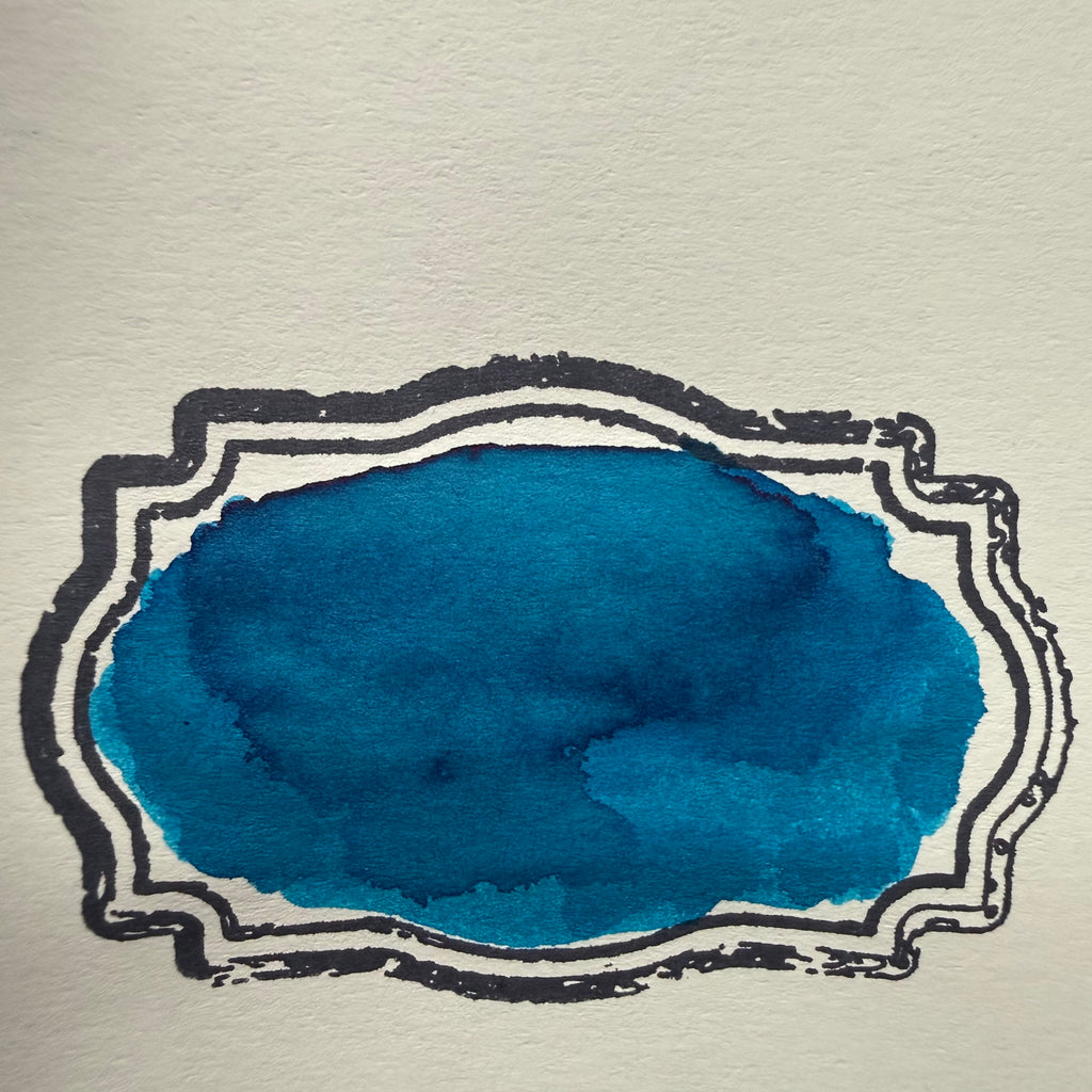 Robert Oster Fire & Ice blue fountain pen ink swatch with pink-red sheen