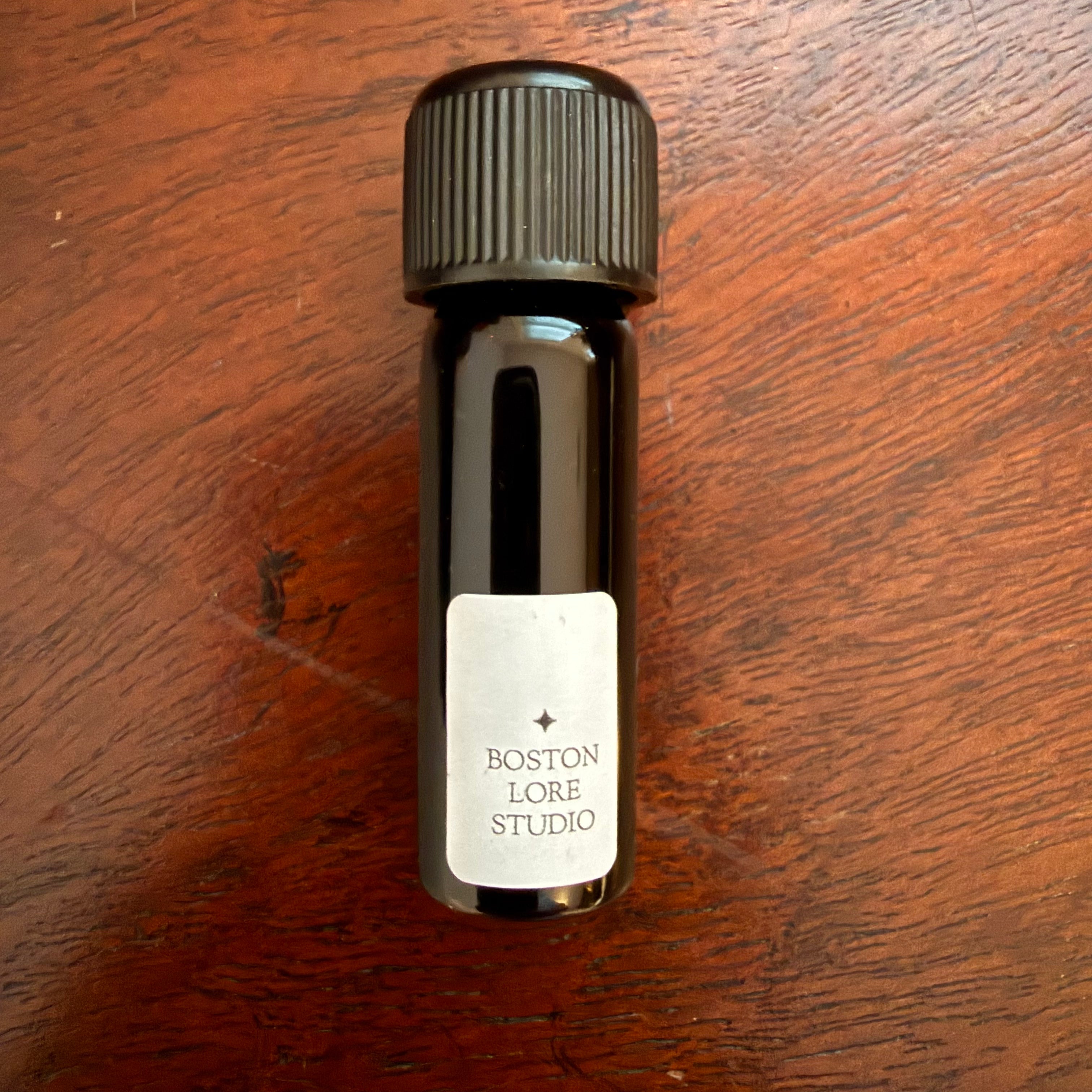 Reverse view of Robert Oster Sepia Nights Archive Bottle with Boston Lore Studio label