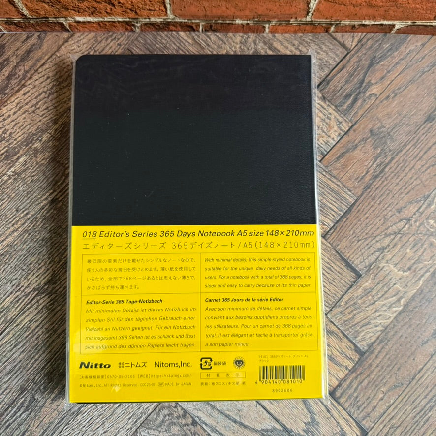 Back of the STALOGY 365Days A5 black notebook with yellow band, made in Japan by Nitto