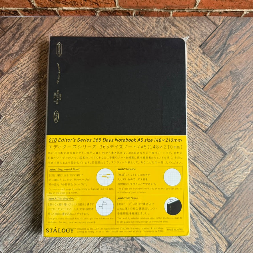 STALOGY Editor's Series 365Days Notebook in A5 with black cloth cover and yellow band
