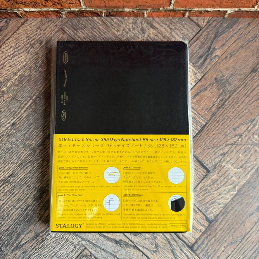STALOGY Editor's Series 365Days Notebook in B6 with black cloth cover and yellow band