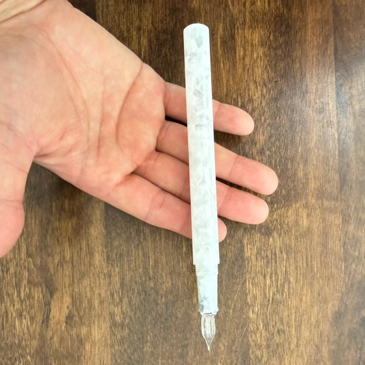 Teranishi Aurora Long glass dip pen held in hand to show size