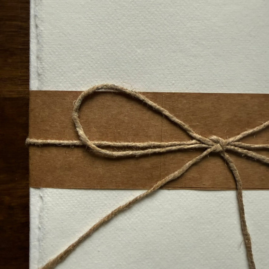 Close-up of Tri-Art 100% cotton correspondence paper showing handmade texture and deckled edges