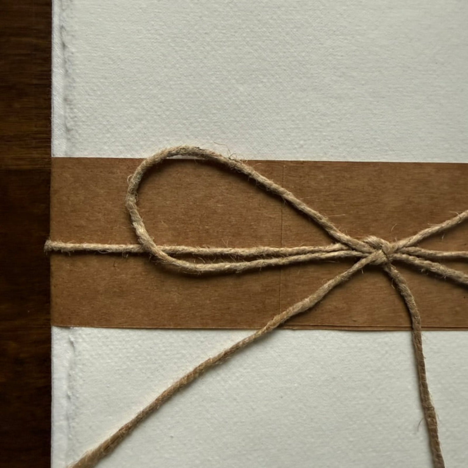 Close-up of Tri-Art 100% cotton correspondence paper showing handmade texture and deckled edges