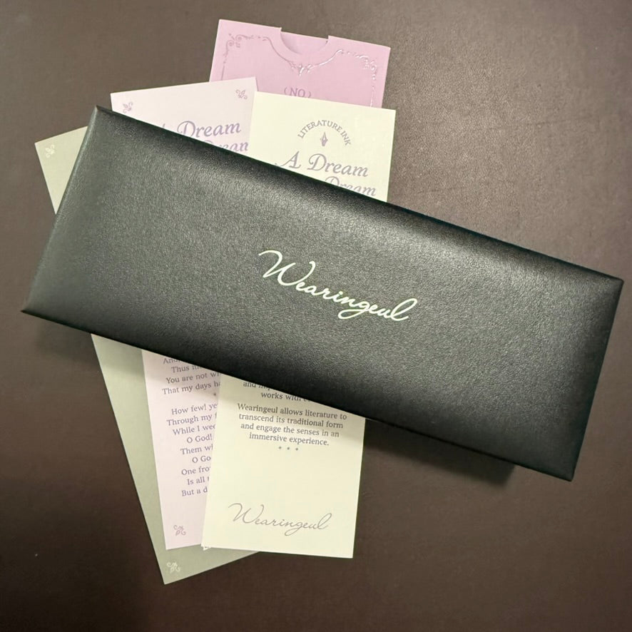 Black Wearingeul storage bag with A Dream Within a Dream literary cards and packaging