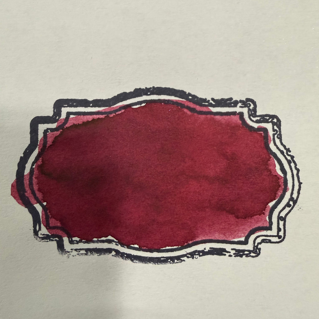 Swatch of Wearingeul Henry Jekyll fountain pen ink showing burgundy-red color and shading