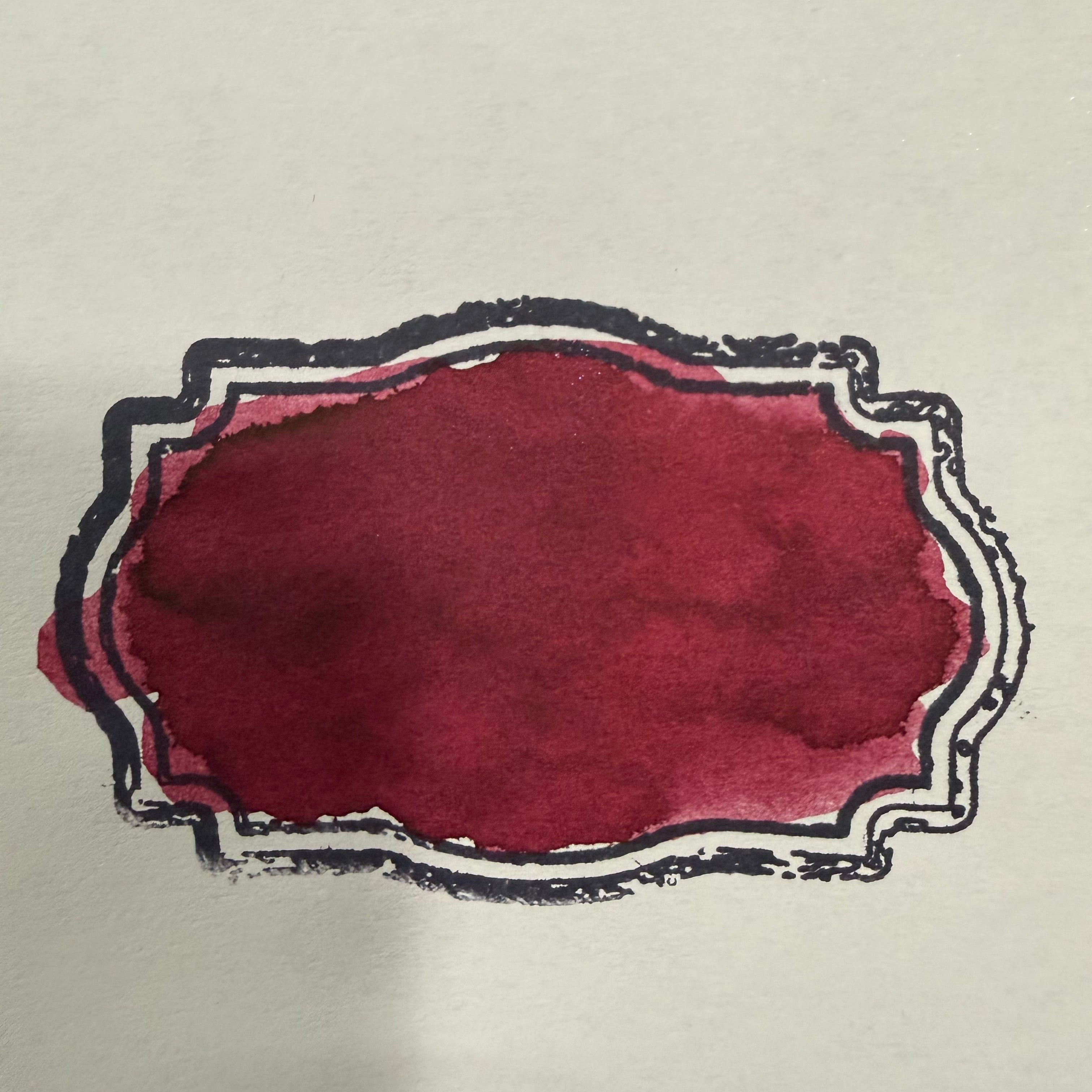Swatch of Wearingeul Henry Jekyll fountain pen ink showing burgundy-red color and shading