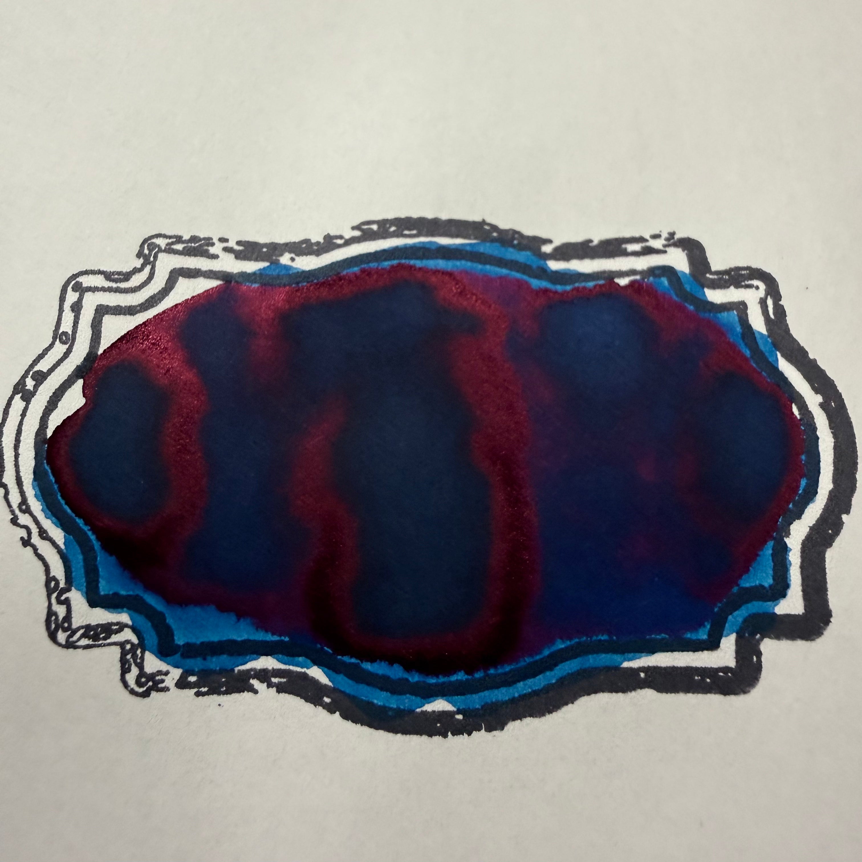 Swatch of Wearingeul The Phantom of the Opera fountain pen ink showing dark blue color with dramatic red sheen
