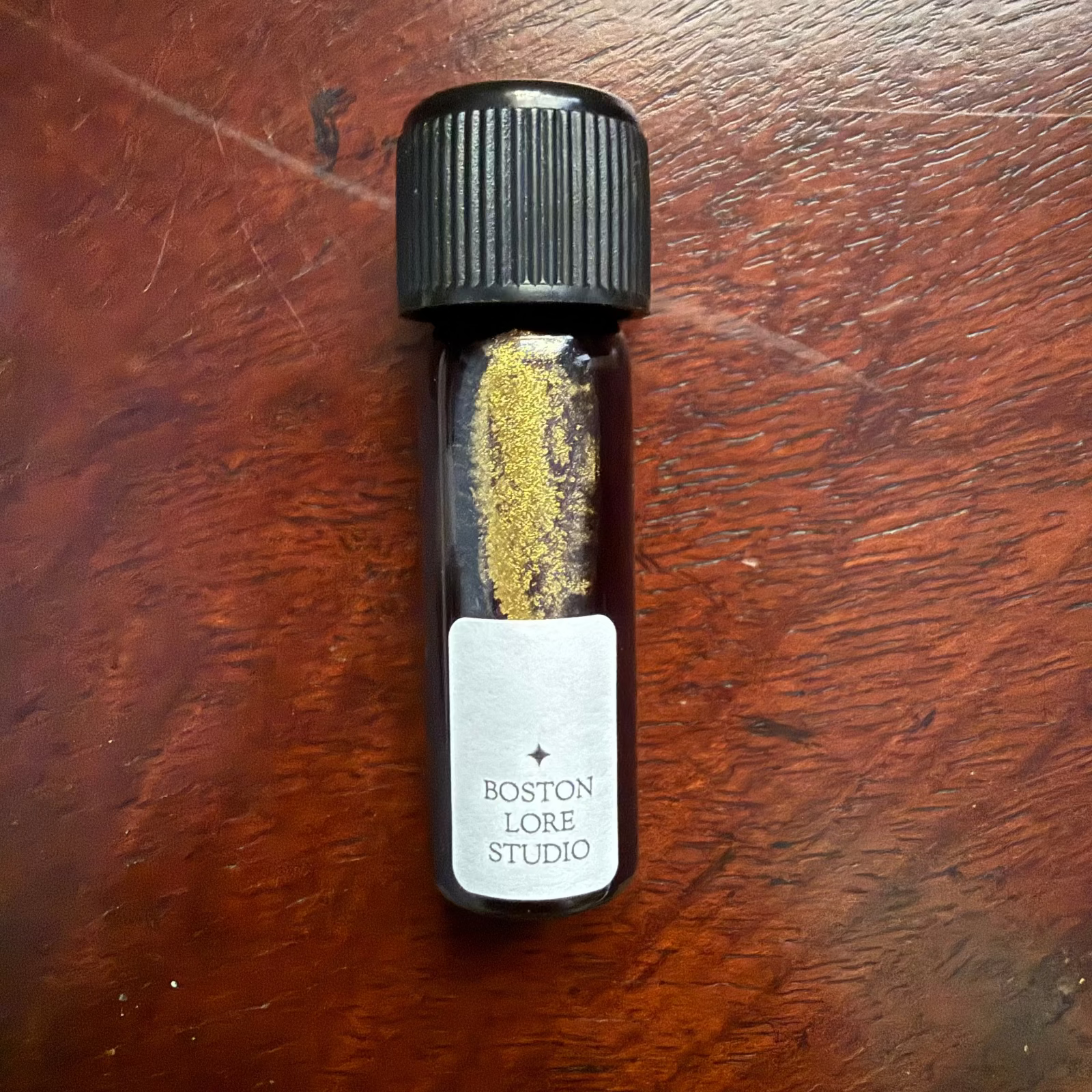 Wearingeul The Happy Prince blue fountain pen ink with gold shimmer in a 5 mL glass bottle