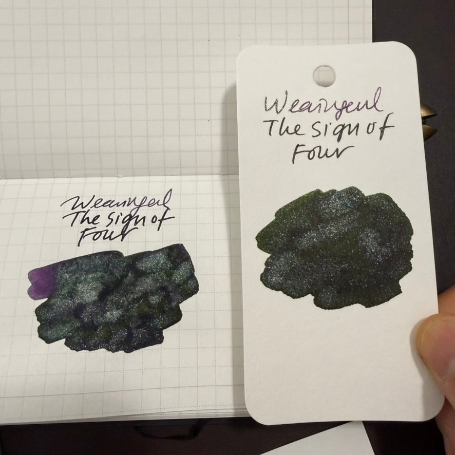 Boston Lore Studio swatch of Wearingeul The Sign of Four fountain pen ink showing purple ink with green sheen and shimmer