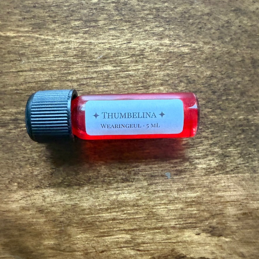 Side view of Wearingeul Thumbelina 5 mL Archive Bottle showing the bright coral pink ink